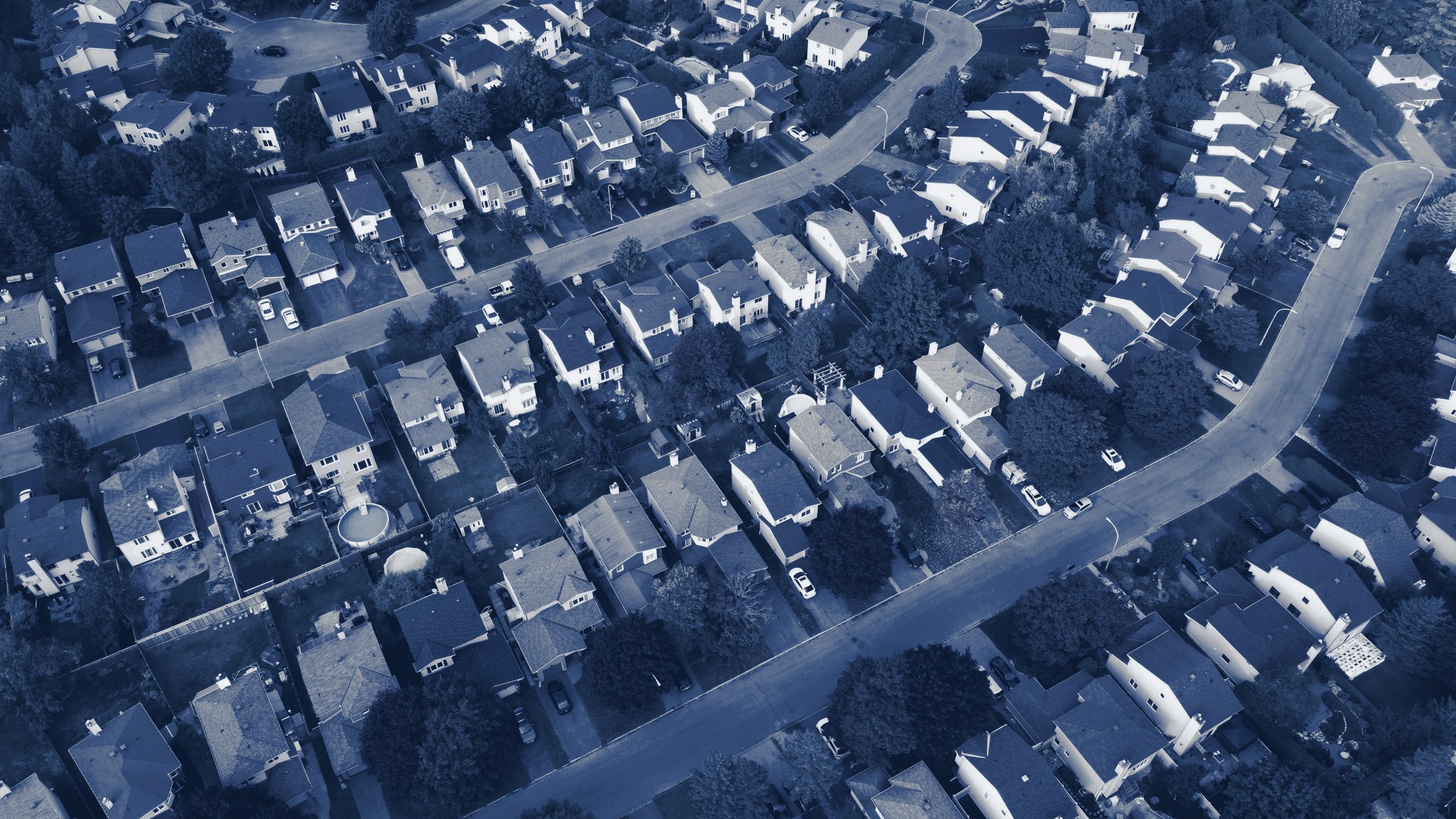 Aerial view of a residential neighborhood, tinted navy
