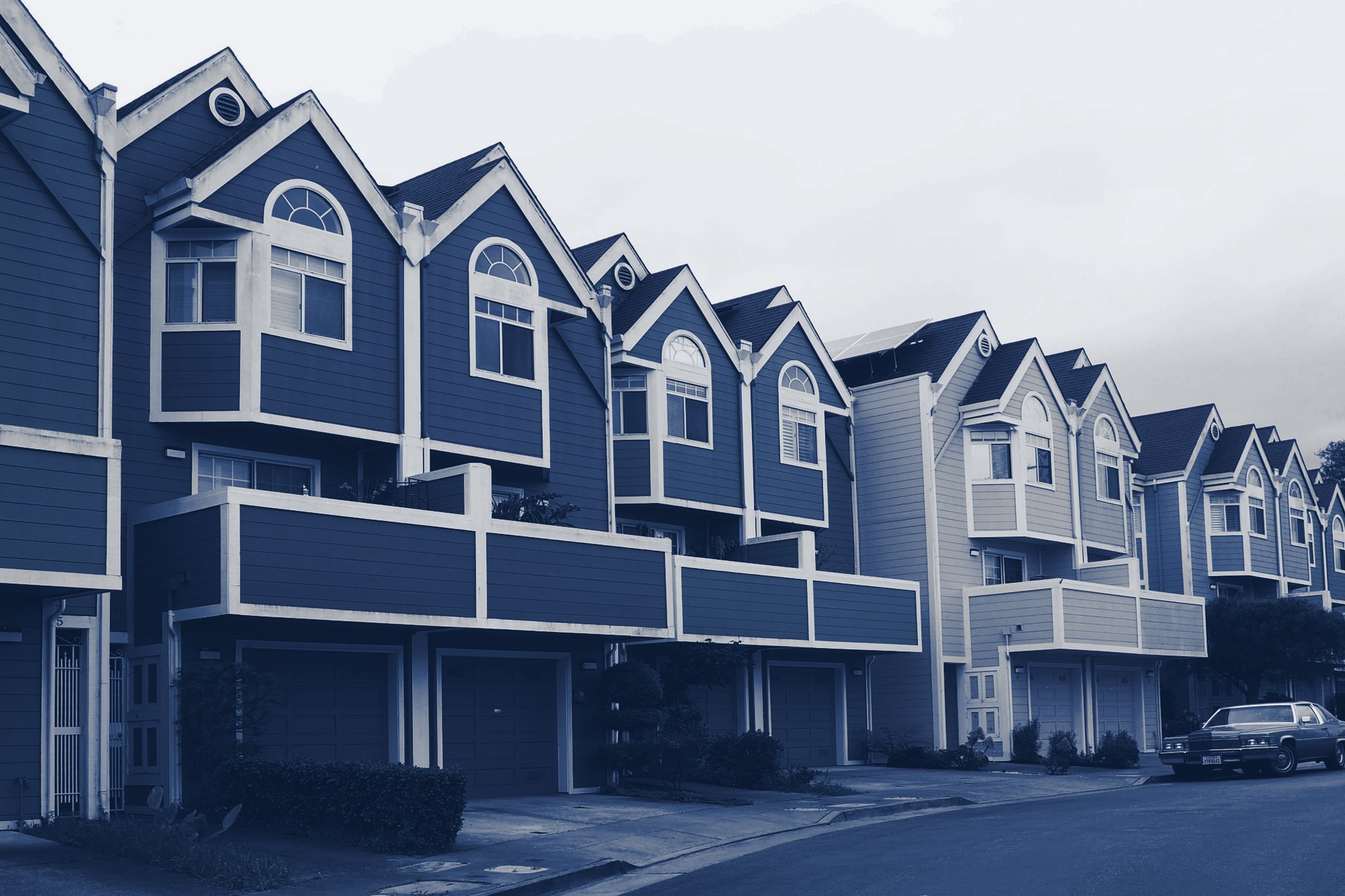 Row of townhomes, tinted navy